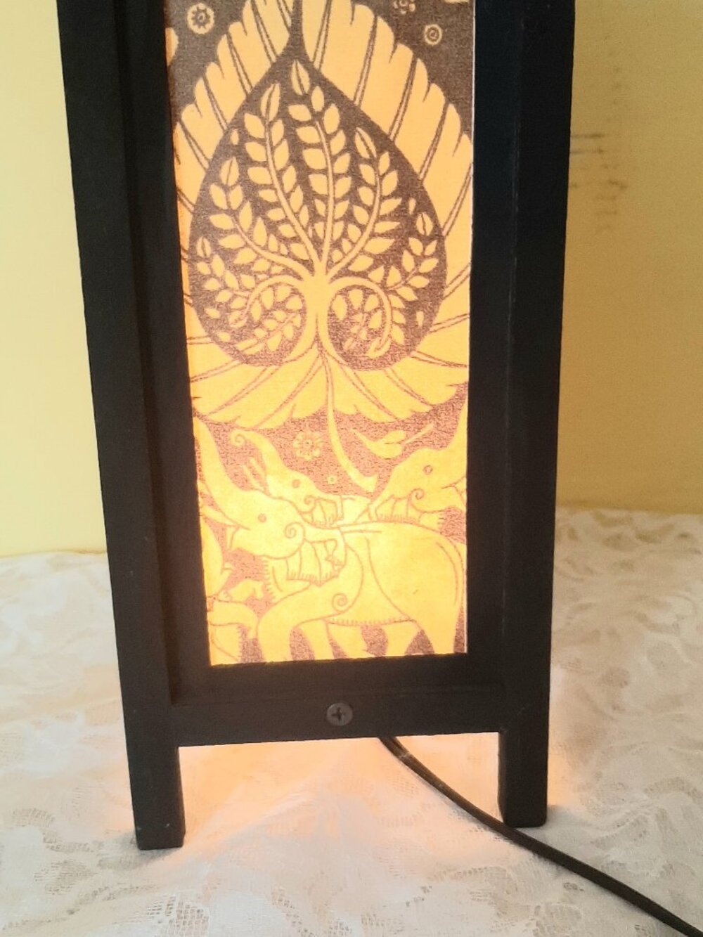 Wood and decorative paper lantern.